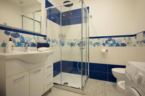 a bathroom with a shower and a sink and a toilet at Danys home in Ischia Town