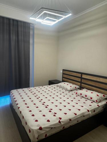 a bedroom with a large bed with red hearts on it at Alvina Complex in Tsaghkadzor