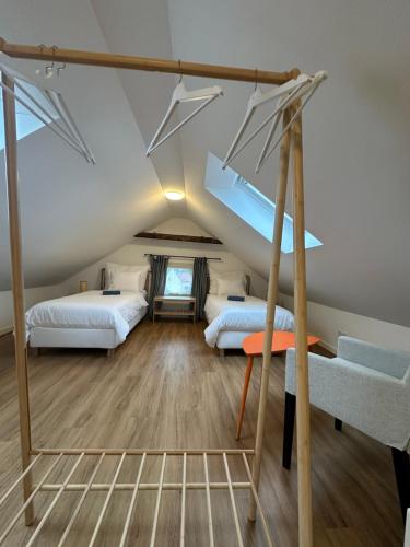 a room with two beds in a attic at Apartmány Tachov in Tachov