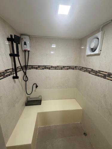 a bathroom with a sink and a toilet in it at Moonrise Beachfront Luxury in Nathon Bay