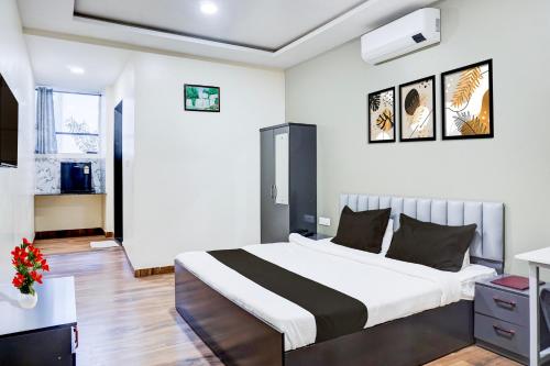 a bedroom with a large bed in a room at Super Collection O Pashan-Sus Road Baner Formerly Grey Stone in Pune