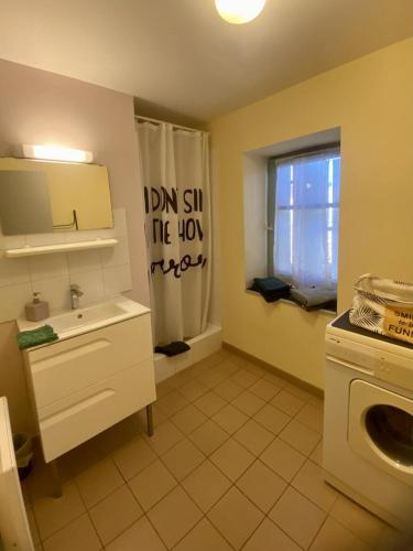 a small kitchen with a sink and a window at La marelle in Villerouge-Termenès