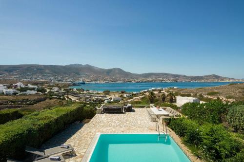 a swimming pool with a view of the ocean at Villa Iliablue in Vrachonisída Petrokáravo