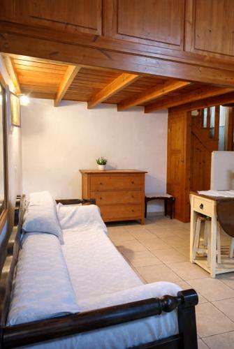a bedroom with two beds and a dresser at Aegean soul apartments in Halki