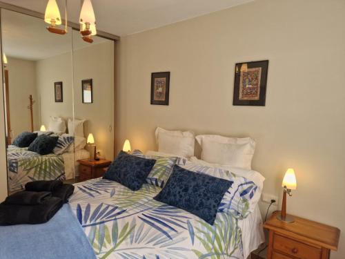 a bedroom with two beds with blue and white sheets at VALDI-BIESCAS in Biescas