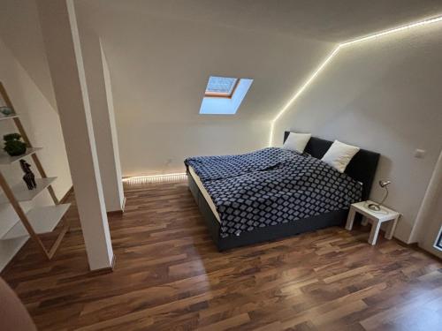 a bedroom with a bed and a skylight at Ferienwohnung Grünblick am Katschbach in Teufenbach