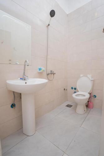a bathroom with a sink and a toilet at Rhala Hostel Egypt in Cairo