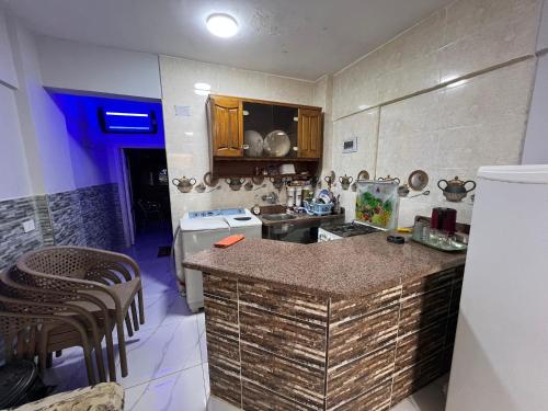 a small kitchen with a counter and a stove at شاليه بقريه روجينا العين السخنه in Ain Sokhna
