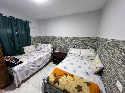 a room with two beds in a room at شاليه بقريه روجينا العين السخنه in Ain Sokhna