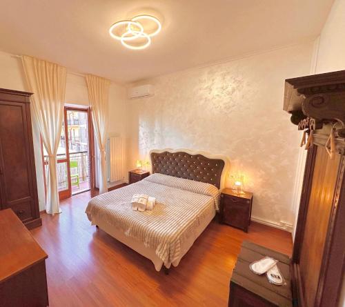 a bedroom with a bed with two towels on it at Suite sogni di lago Lecco, Como in Malgrate
