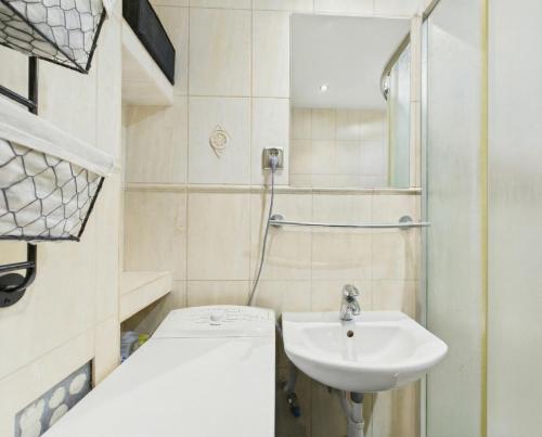a bathroom with a sink and a shower at Mieszkanie na Alei in Głogów
