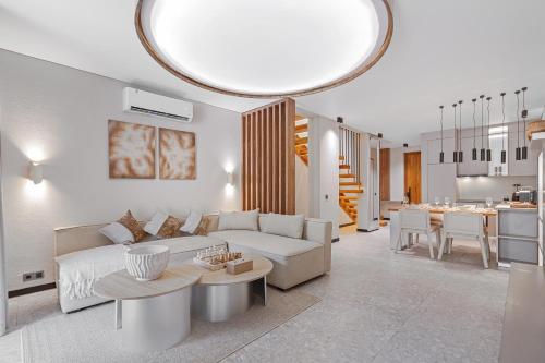a living room with a couch and a table at Balangan Residence in Payangan