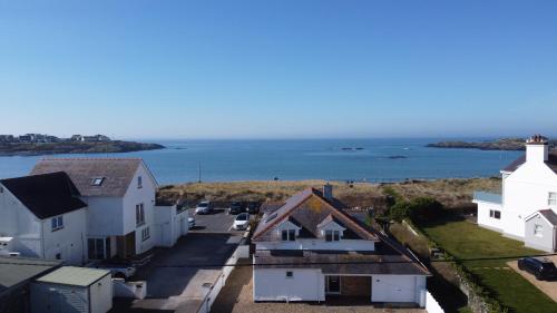 an aerial view of houses and the ocean at BEACH SIDE Sea Shanty House in Trearddur