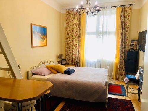 a bedroom with a bed and a window at Sharm Sweet Studio Best location quiet and cozy in Helsinki