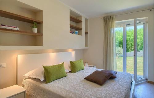 a bedroom with a bed with two pillows on it at Villa Hemera - Oasis of Peace and Privacy by Istrabook in Kršan