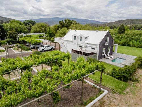 an aerial view of a house with a garden at The Barn On 62 - Cottages in Montagu