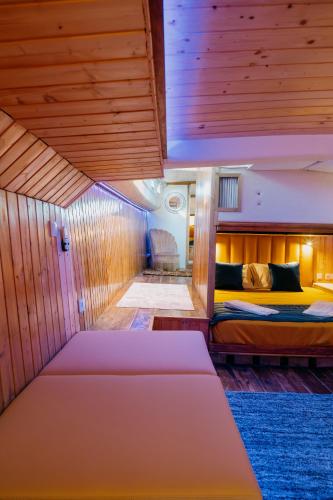 a bedroom with two beds in a room at SLEEPBOAT Golden Life Yacth Oporto in Douro in Porto