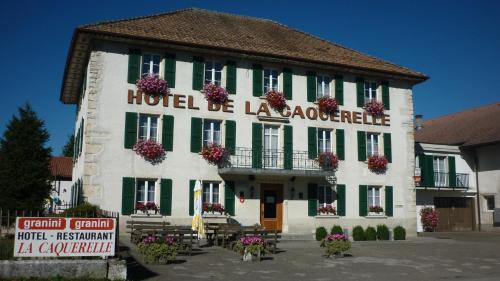 a large building with green and white at La Caquerelle in Col des Rangiers