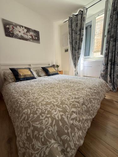 a bedroom with a large bed in a room at Monica's home in Ariccia