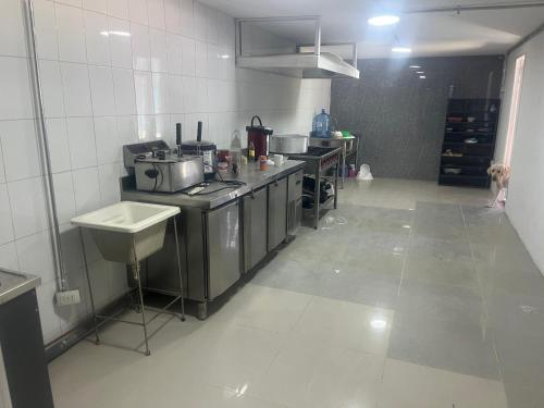 a kitchen with a stove and a sink in it at Duval in Calama
