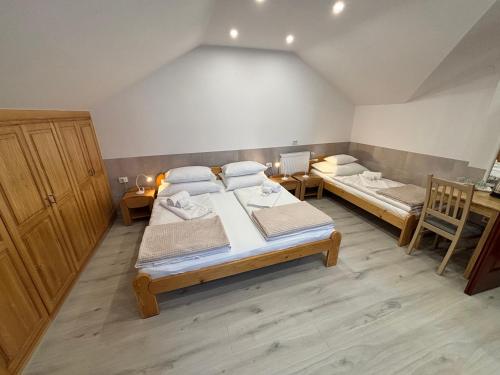 a bedroom with two beds in a room at Euro Accommodation in Debrecen