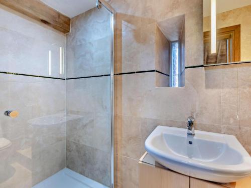 a bathroom with a sink and a shower at 2 Bed in Launceston oc-95236 in Saint Giles on the Heath