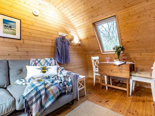 a living room with a couch and a table at 1 Bed in Padstow oc-77748 in Padstow