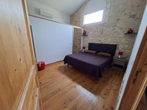 Llit o llits en una habitació de Gîte la mirabelle