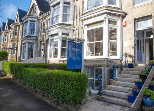 a building with a sign in front of it at The Tremont in Penzance