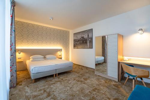 Krevet ili kreveti u jedinici u okviru objekta Hotel Metropol