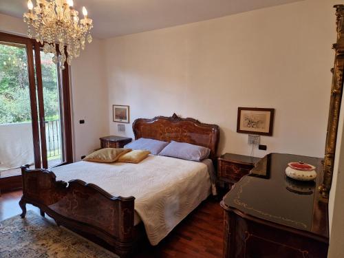 a bedroom with a large bed and a table at B&B Art Experience Novecento e Dintorni in Monte Grimano Terme