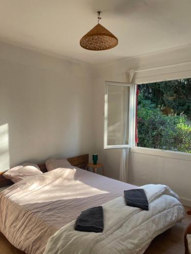 Foto La petite maison près de la mer, avec jardin , parking et clim 2