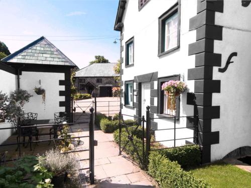 a house with a black and white fence at Sherrifs Lodge - Hw7730 in Llangadog