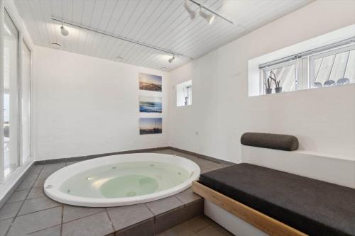 a large bath tub in a bathroom with a window at 1356-Thisted-Nordsovej-106 in Thisted