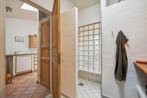 a bathroom with a shower and a door at 1075-Hanstholm-Badsgardsvej-25 in Hanstholm