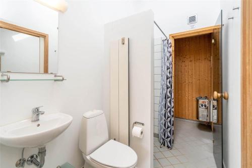 a bathroom with a white toilet and a sink at 711-Hvide-Sande-Slusen-11 in Hvide Sande