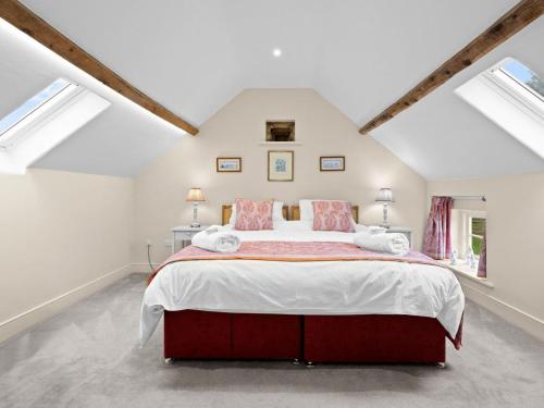 a bedroom with a large bed in a attic at 2 Bed in Ludlow oc-83363 in Hopton Cangeford