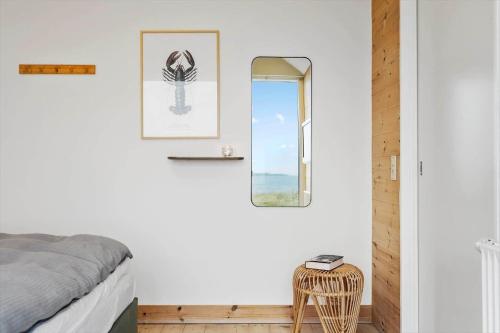 a bedroom with a bed and a window at 701-Hvide-Sande-Slusen-1 in Hvide Sande