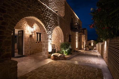 an entrance to a building with lights on it at Alistos Hotel in Gythio