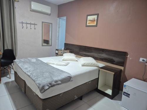 a bedroom with a bed in a room at Hotel Faf's Interlagos - SP in São Paulo