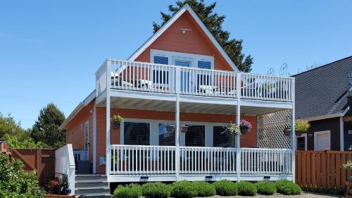 a house with a white deck and a balcony at Sunkissed 3BR Oceanview, Dog-Friendly Beach Home in Pacific Beach