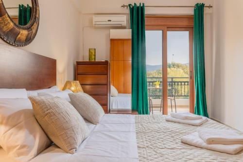 a bedroom with a large bed with green curtains at LuckyWoodyApartment in (( Kermetés ))