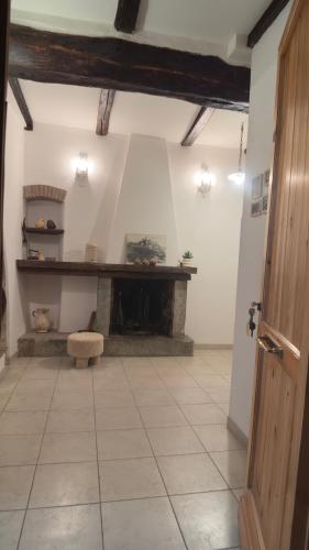 a living room with a fireplace in a room at Residenza Caterina in Bolsena