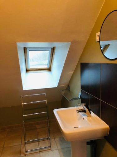 a bathroom with a sink and a window at Parfums des peintres proche Crozant - Chambres d'hôtes in Villard