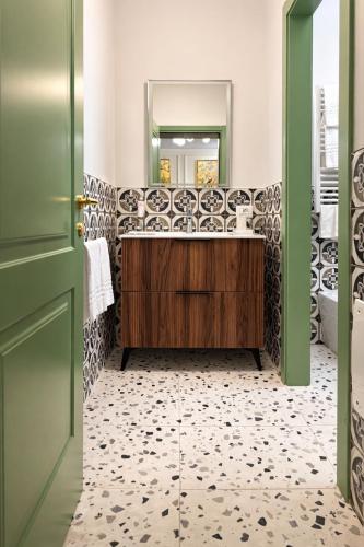 a bathroom with a sink and a mirror at Residence Corte Bizantina in Ravenna
