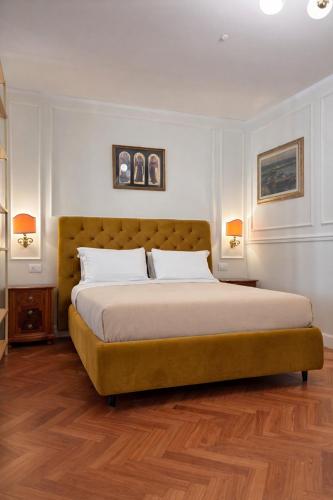 a bedroom with a large bed in a room at Residence Corte Bizantina in Ravenna