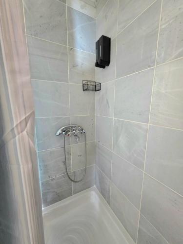 a bathroom with a shower with a bath tub at Off Grid Romance in Samos in Ireon