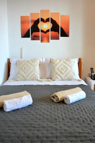 a bedroom with a bed with two towels on it at Off Grid Romance in Samos in Ireon