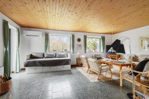 a bedroom with a bed and a table and chairs at 3076-Stege-Rusen-16 in Stege