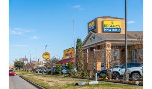 a building with a sign that reads bakery inn and suites at Regency Inn & Suites Houston East I 10 in Houston